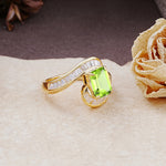Unique Luxurious Twisted 4-Prong Emerald Cut Peridot Engagement Ring - Additional view